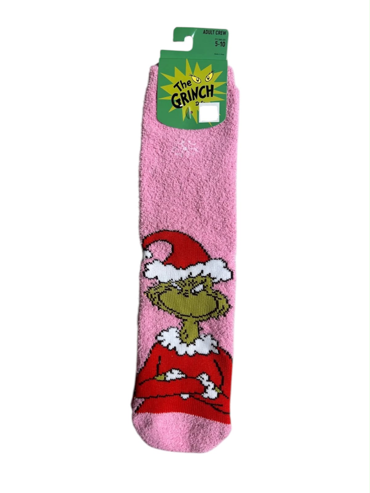 Calcetas afelpadas de color rosa con un diseño navideño de El Grinch.